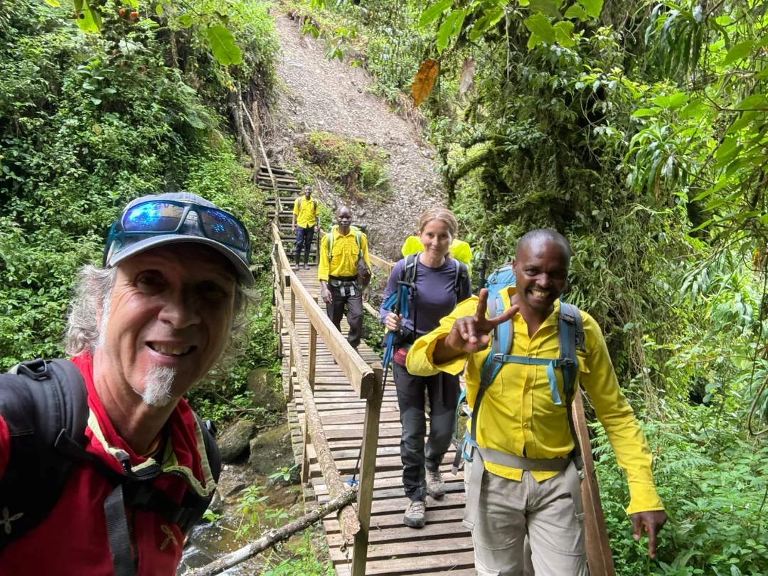 Lush green trails through a Uganda forest.